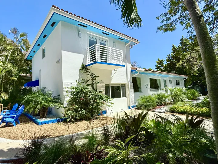 House exterior with mature greenery
