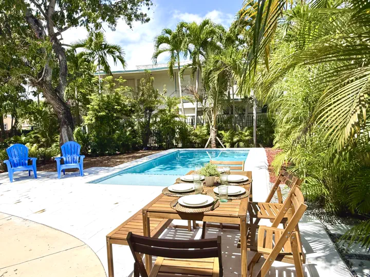Pool patio with dining and loungers